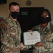 Alaska Army National Guard Sergeant 1st Class Julena Felix, 297th Regional Support Group, receives an Army Commendation Medal.