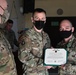 Alaska Army National Guard Chief Warrant Officer 2 Jesse Ferrelli, 297th Regional Support Group, receives an Army Commendation Medal.