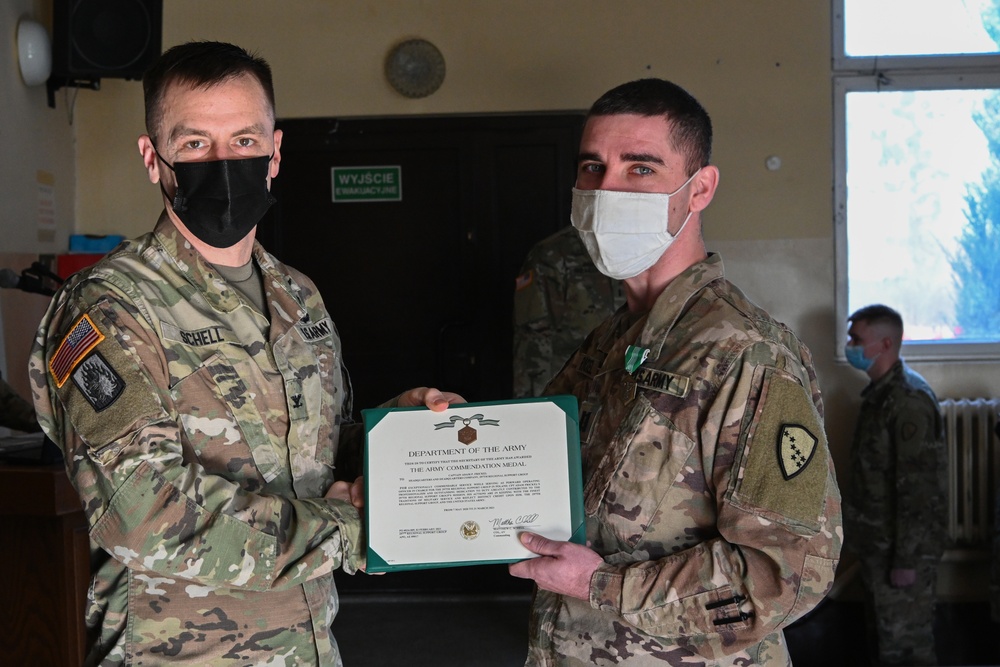 U.S Army First Lieutenant Frickel, 652nd Regional Support Group, receives an Army Commendation Medal.