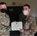 U.S Army First Lieutenant Frickel, 652nd Regional Support Group, receives an Army Commendation Medal.