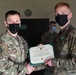 Alaska Army National Guard Specialist Matthew Goudy, 297th Regional Support Group, receives an Army Commendation Medal.