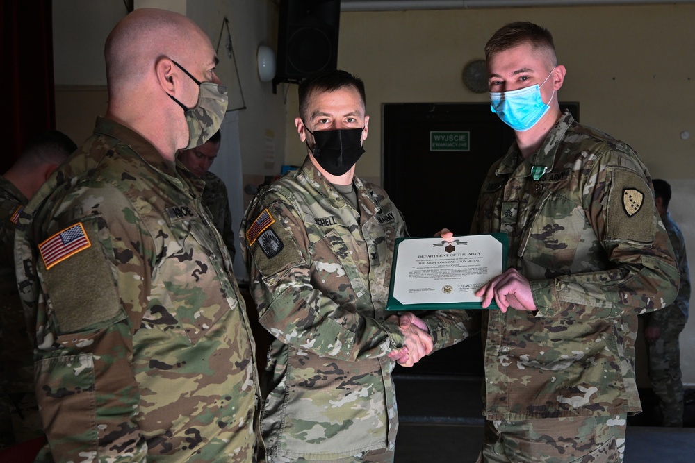 Alaska Army National Guard Sergeant Ryan Hickok, 297th Regional Support Group, receives an Army Commendation Medal.