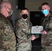 Alaska Army National Guard Sergeant Ryan Hickok, 297th Regional Support Group, receives an Army Commendation Medal.