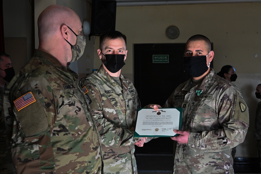 Alaska Army National Guard Captain Anthony Montoya, 297th Regional Support Group, receives an Army Commendation Medal.