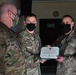 Alaska Army National Guard Captain Anthony Montoya, 297th Regional Support Group, receives an Army Commendation Medal.