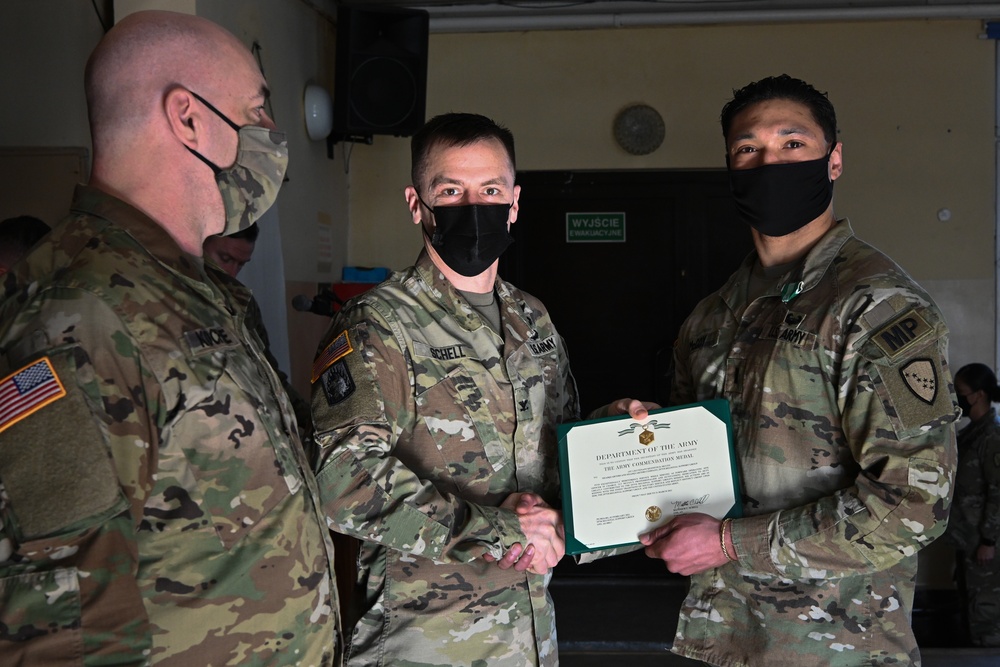 Alaska Army National Guard First Lieutenant Kenneth McCoy, 297th Regional Support Group, receives an Army Commendation Medal.