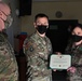 Alaska Army National Guard Captain Jamia Odom, 297th Regional Support Group, receives an Army Commendation Medal.