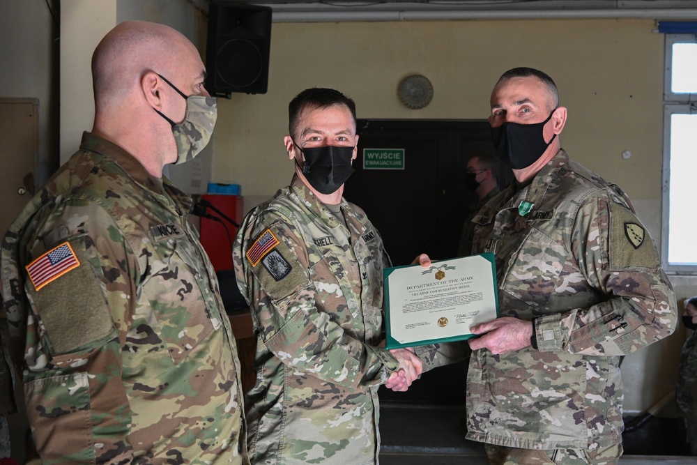 Alaska Army National Guard Chief Warrant Officer Four Mark Nieto, 297th Regional Support Group, receives an Army Commendation Medal.