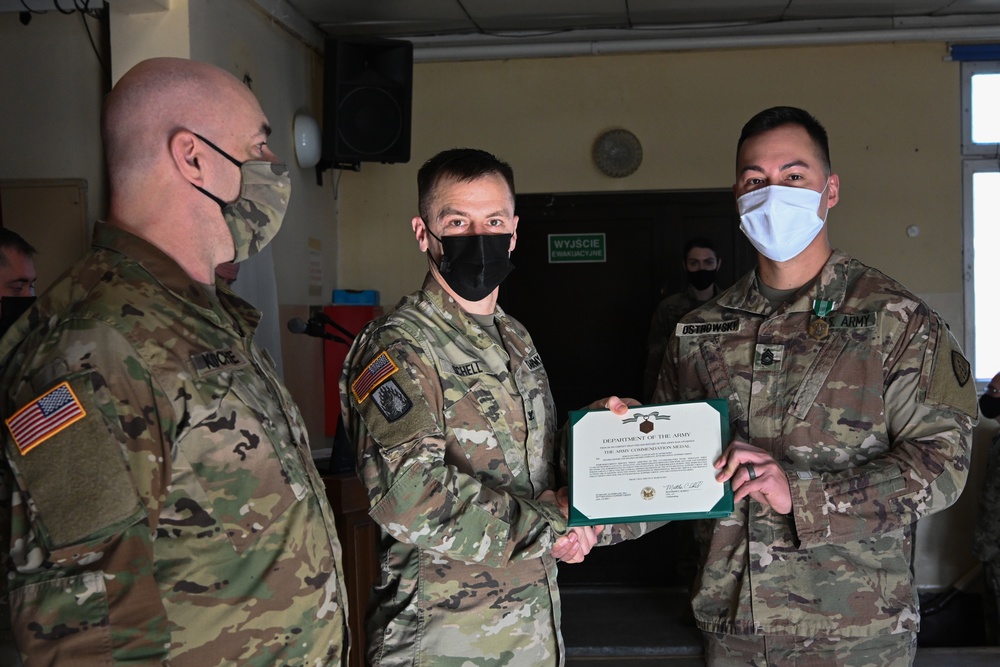 Alaska Army National Guard Sergeant1st Class Duane Ostrowski, 297th Regional Support Group, receives an Army Commendation Medal.