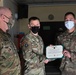 Alaska Army National Guard Sergeant1st Class Duane Ostrowski, 297th Regional Support Group, receives an Army Commendation Medal.