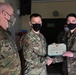 Alaska Army National Guard Specialist Nicole Raabe, 297th Regional Support Group, receives an Army Commendation Medal.