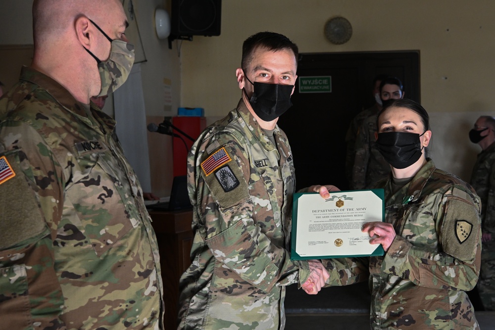 Alaska Army National Guard Specialist Delaney Pletsch, 297th Regional Support Group, receives an Army Commendation Medal.