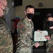 Alaska Army National Guard Specialist Delaney Pletsch, 297th Regional Support Group, receives an Army Commendation Medal.