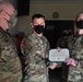 Alaska Army National Guard Captain Michael Thrall, 297th Regional Support Group, receives an Army Commendation Medal.