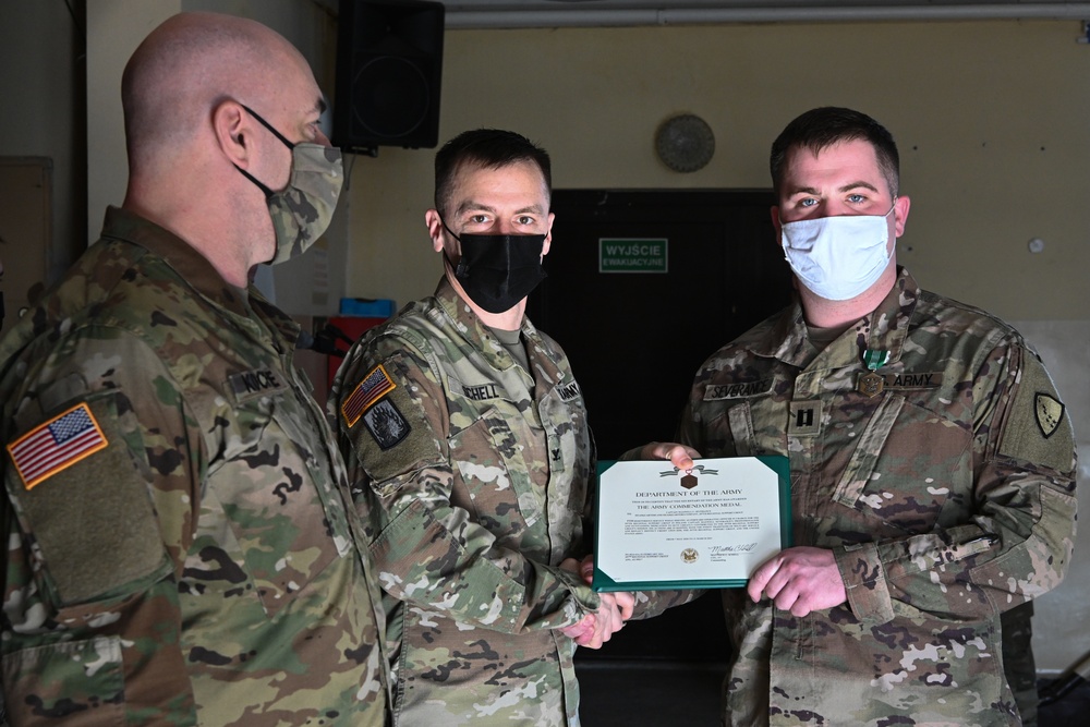 Alaska Army National Guard First Lieutenant Maxwell Severance, 297th Regional Support Group, receives an Army Commendation Medal.