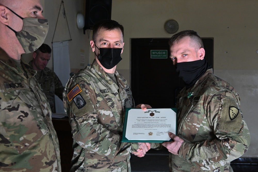 Alaska Army National Guard Sergeant 1st Class Dayton Will, 297th Regional Support Group, receives an Army Commendation Medal.