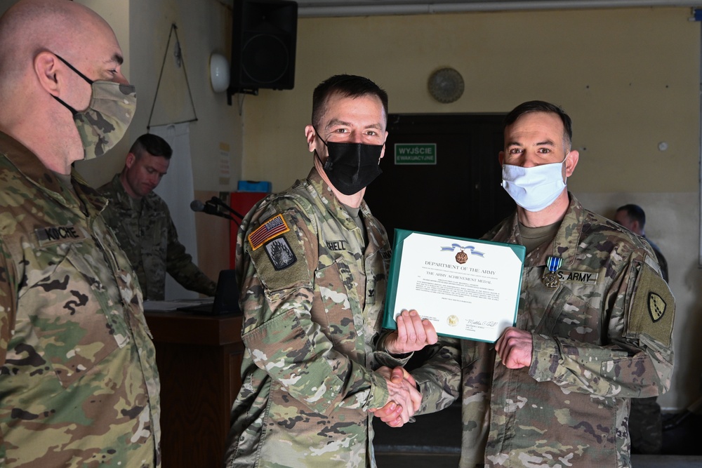 Alaska Army National Guard Sergeant 1st Class Brandon Amerone, 297th Regional Support Group, receives an Army Achievement Medal.
