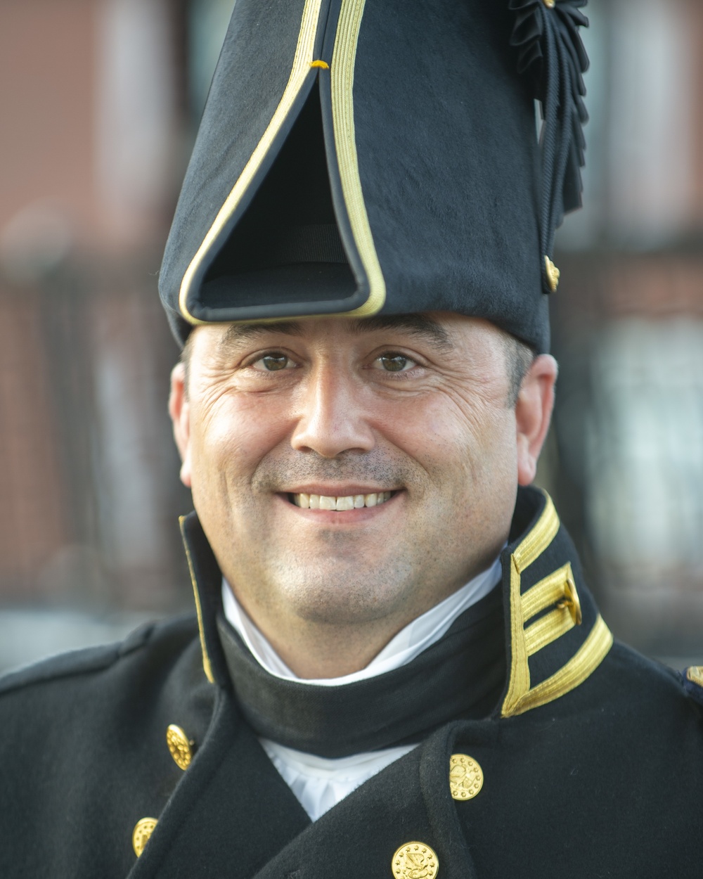 Lieutenant Commander Andrew Broyles poses for a photo onboard USS Constitution