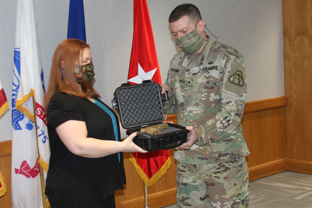 Brig. Gen. Dean receives pistol from General Officer Pistol Program