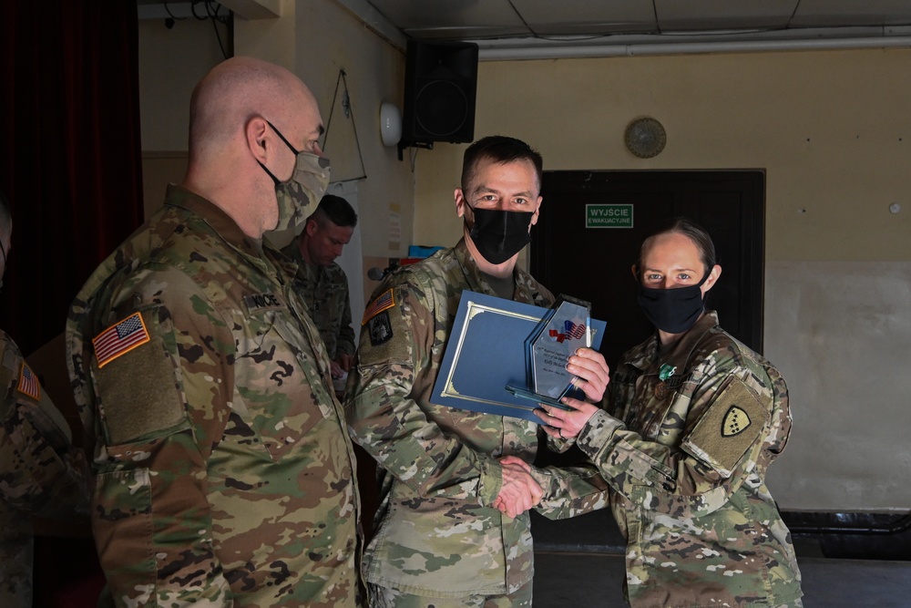 Alaska Army National Guard Staff Sergeant Kelly McLachlan, 297th Regional Support Group, received a plaque for Noncommissioned Officer of the Deployment.