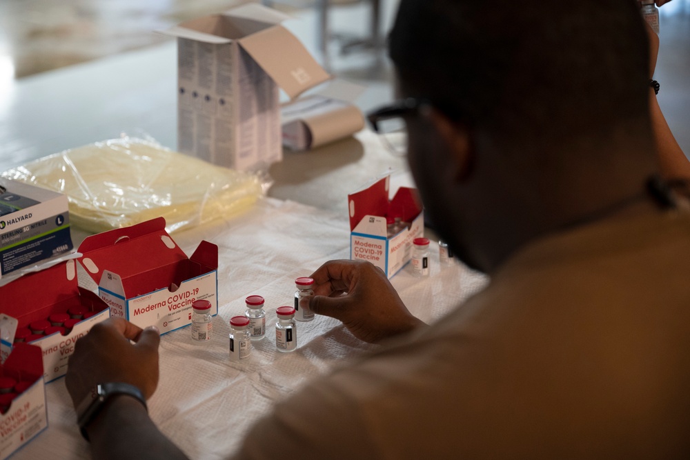 Medical personnel administer COVID-19 vaccine at Camp Lemonnier Djibouti