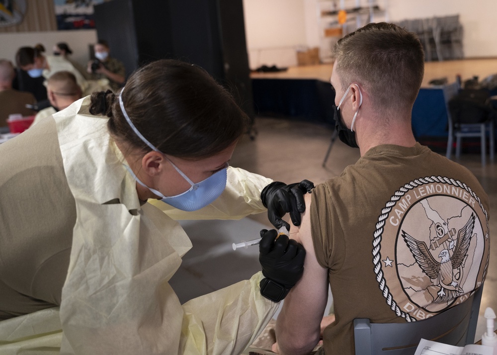 Medical personnel administer COVID-19 vaccine at Camp Lemonnier Djibouti
