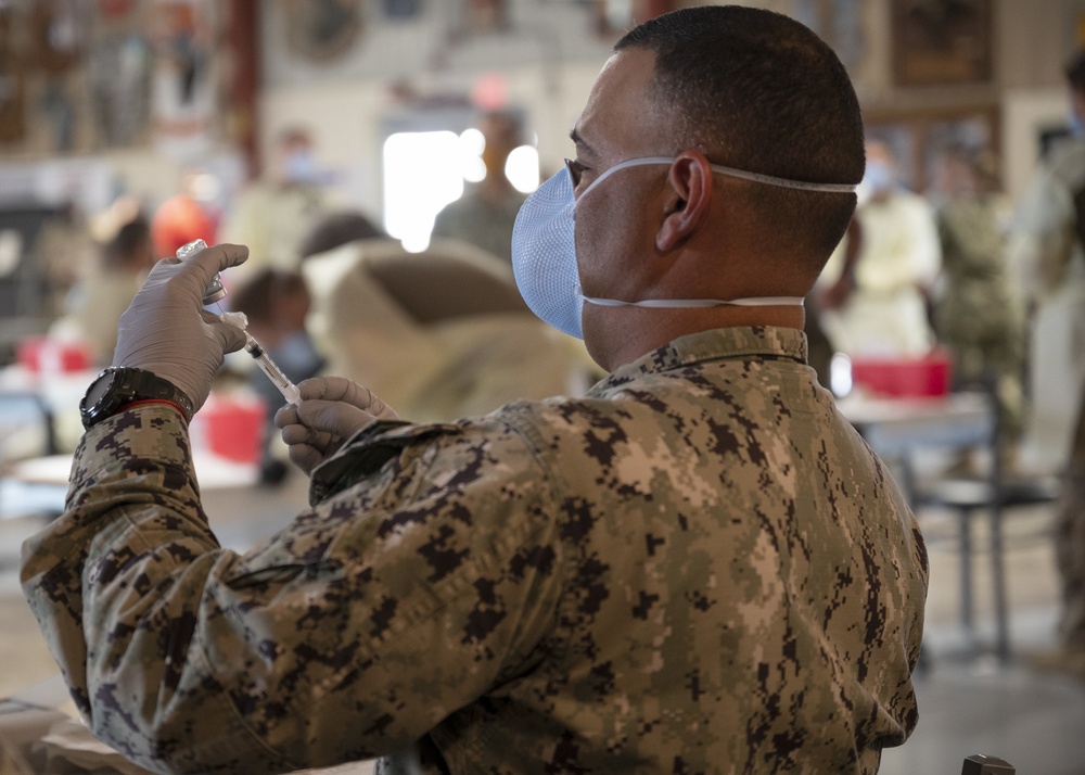 Medical personnel administer COVID-19 vaccine at Camp Lemonnier Djibouti