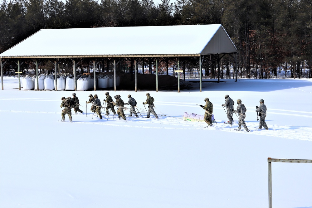 Fort McCoy CWOC class 21-04 students conduct field training in snowshoes, pulling sleds