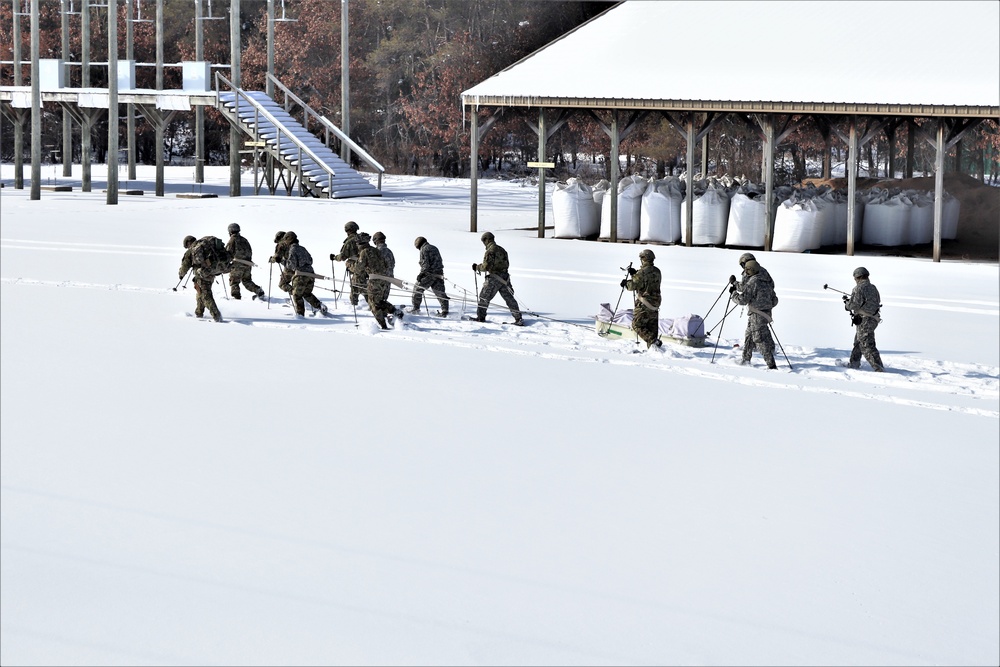 Fort McCoy CWOC class 21-04 students conduct field training in snowshoes, pulling sleds