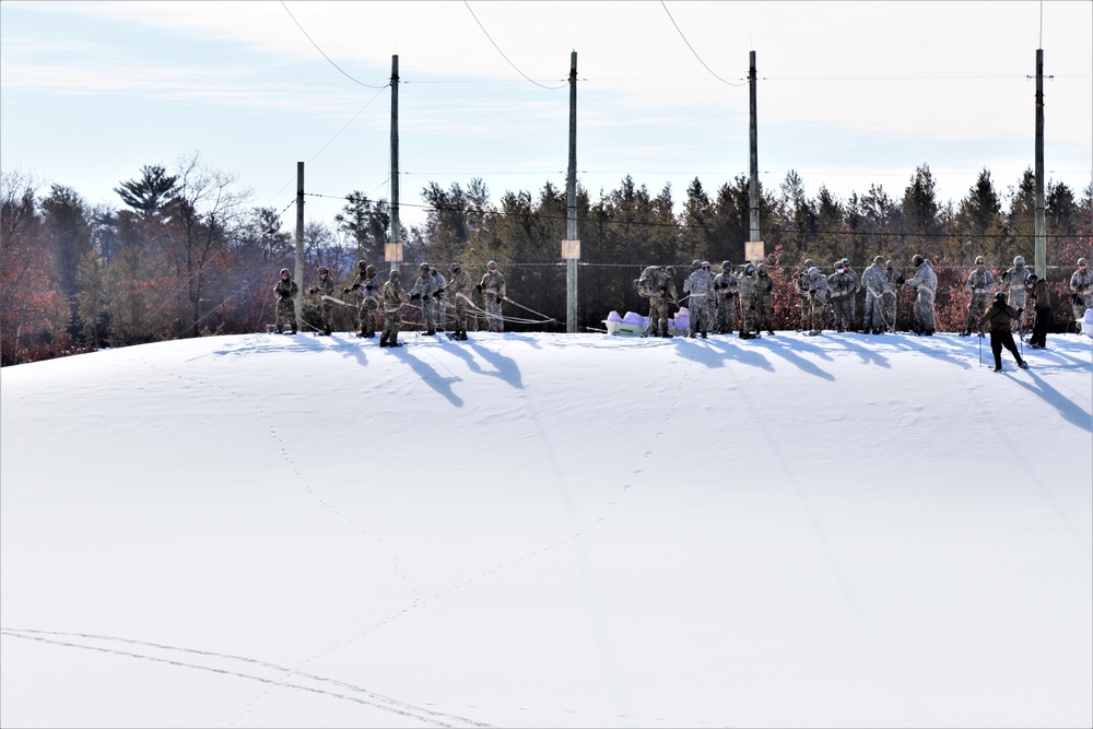 Fort McCoy CWOC class 21-04 students conduct field training in snowshoes, pulling sleds