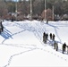 Fort McCoy CWOC class 21-04 students conduct field training in snowshoes, pulling sleds
