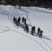 Fort McCoy CWOC class 21-04 students conduct field training in snowshoes, pulling sleds