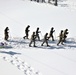 Cold-Weather Operations Course class 21-04 students conduct field training in snowshoes, pulling sleds