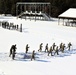 Cold-Weather Operations Course class 21-04 students conduct field training in snowshoes, pulling sleds