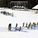 Cold-Weather Operations Course class 21-04 students conduct field training in snowshoes, pulling sleds