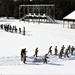 Cold-Weather Operations Course class 21-04 students conduct field training in snowshoes, pulling sleds