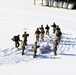 Cold-Weather Operations Course class 21-04 students conduct field training in snowshoes, pulling sleds