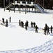 Cold-Weather Operations Course class 21-04 students conduct field training in snowshoes, pulling sleds