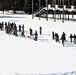 Cold-Weather Operations Course class 21-04 students conduct field training in snowshoes, pulling sleds