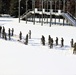 Cold-Weather Operations Course class 21-04 students conduct field training in snowshoes, pulling sleds