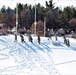 Cold-Weather Operations Course class 21-04 students conduct field training in snowshoes, pulling sleds