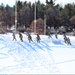 Cold-Weather Operations Course class 21-04 students conduct field training in snowshoes, pulling sleds