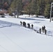 Cold-Weather Operations Course class 21-04 students conduct field training in snowshoes, pulling sleds