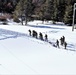 Cold-Weather Operations Course class 21-04 students conduct field training in snowshoes, pulling sleds