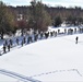 Cold-Weather Operations Course class 21-04 students conduct field training in snowshoes, pulling sleds