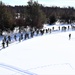 Cold-Weather Operations Course class 21-04 students conduct field training in snowshoes, pulling sleds