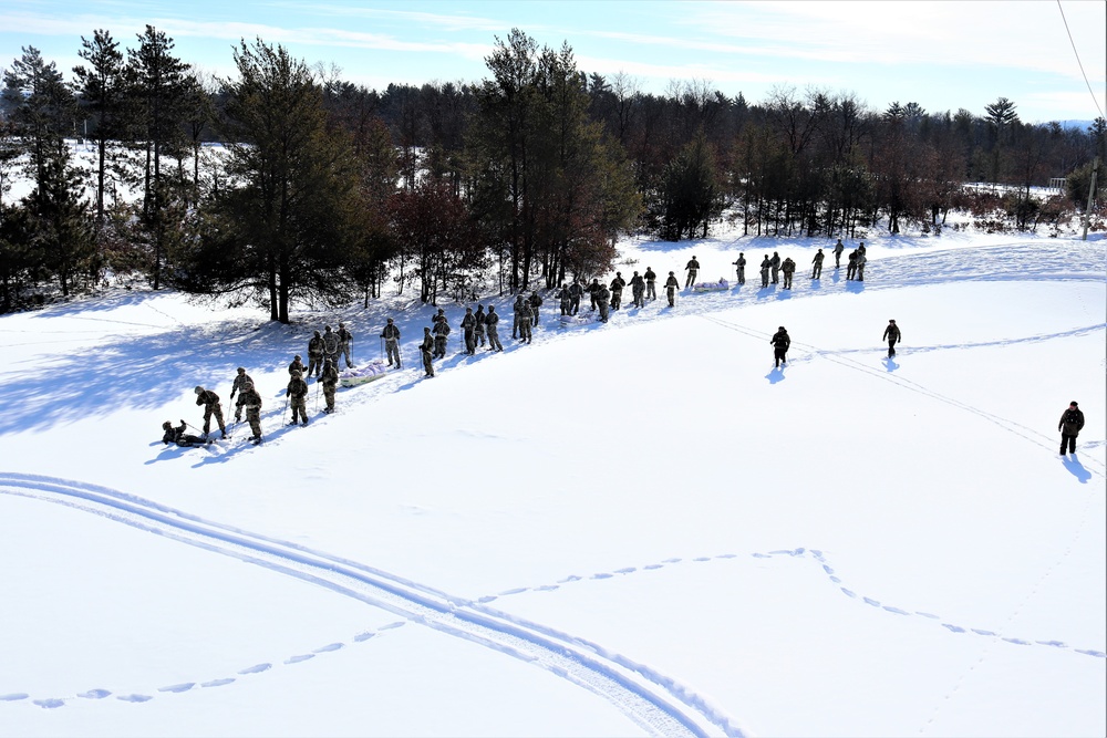 Cold-Weather Operations Course class 21-04 students conduct field training in snowshoes, pulling sleds