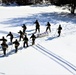 Cold-Weather Operations Course class 21-04 students conduct field training in snowshoes, pulling sleds