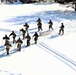 Cold-Weather Operations Course class 21-04 students conduct field training in snowshoes, pulling sleds