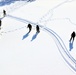 Cold-Weather Operations Course class 21-04 students conduct field training in snowshoes, pulling sleds